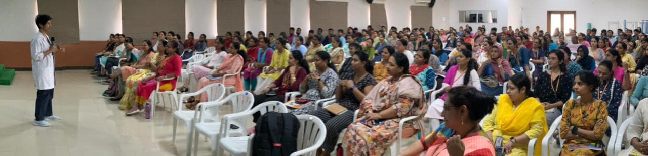 Dr. T. Rajeshwari Reddy leading a women's preventive health awareness session